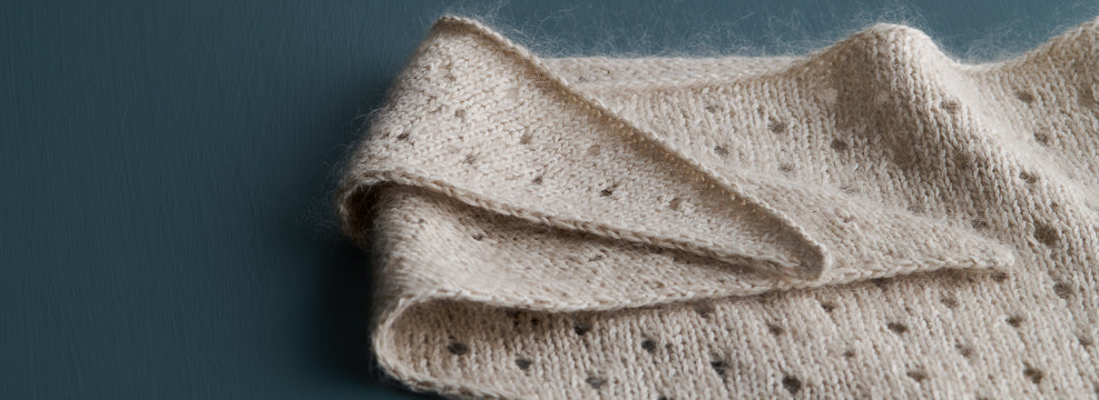 Our free Little Dot Bandana knitting pattern, knit with Purl Soho's Cattail Silk and Tussock yarns held together.