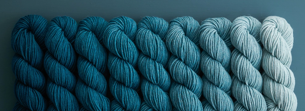 Shop DK-weight yarns, including our gradient Nine-Note Bundles, beautiful merino wool and alpaca DK yarn.